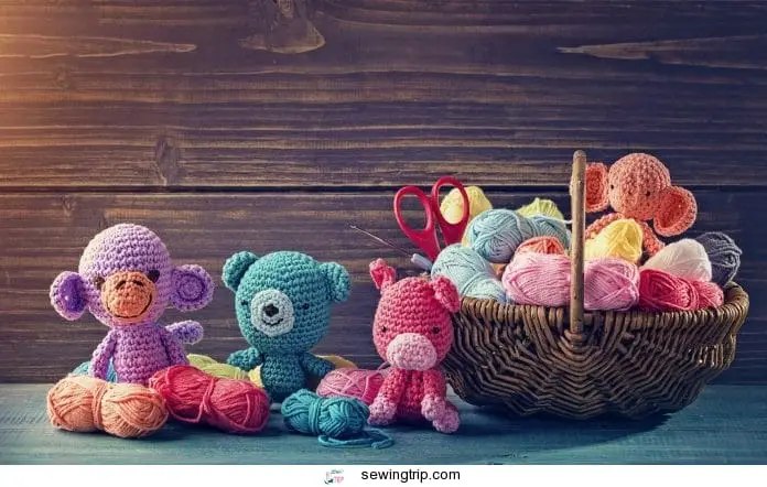 Amigurumi toy animals next to a basket