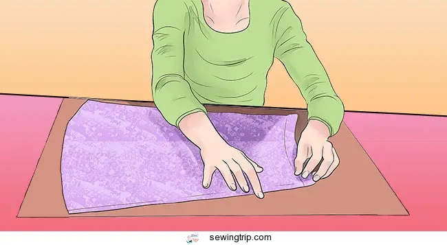 how to make a pattern for a dress: Flatten the original garment on top of the paper
