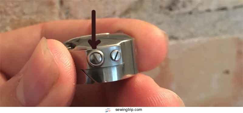 Sewing Machine Bobbin Problems | 11 Issues & solutions 3 Tension screw on the bobbin case