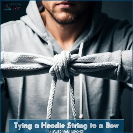 Tying a Hoodie String to a Bow