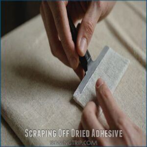 Scraping Off Dried Adhesive Scraping Off Dried Adhesive