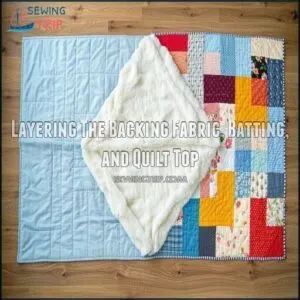 Layering The Backing Fabric, Batting, and Quilt Top