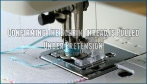 confirming the bobbin thread is pulled under pretension