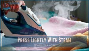 press lightly with steam