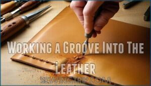 working a groove into the leather