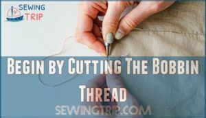 begin by cutting the bobbin thread