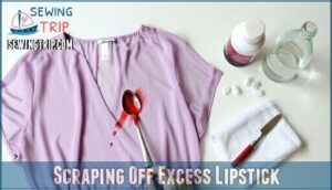 scraping off excess lipstick