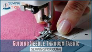 guiding needle through fabric