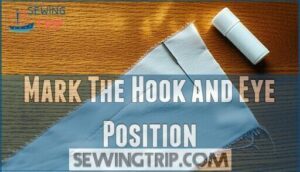 mark the hook and eye position