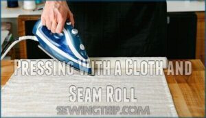 pressing with a cloth and seam roll