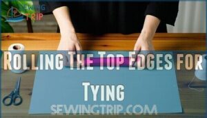 rolling the top edges for tying
