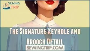 the signature keyhole and brooch detail the signature keyhole and brooch detail